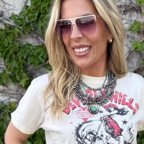 Woman wearing Sterling Silver Navajo Pearl necklaces, sunglasses and  graphic tee