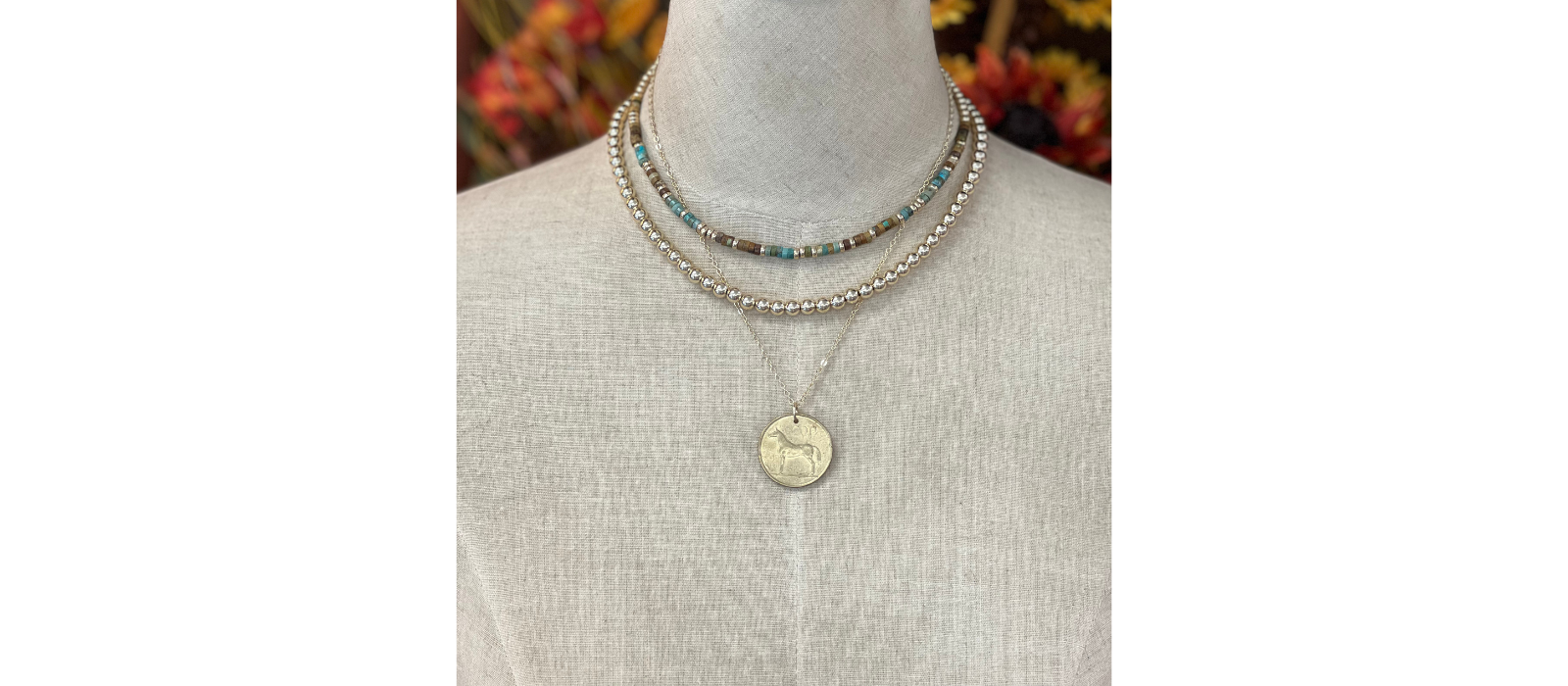 Necklace on a mannequin with a blurred background